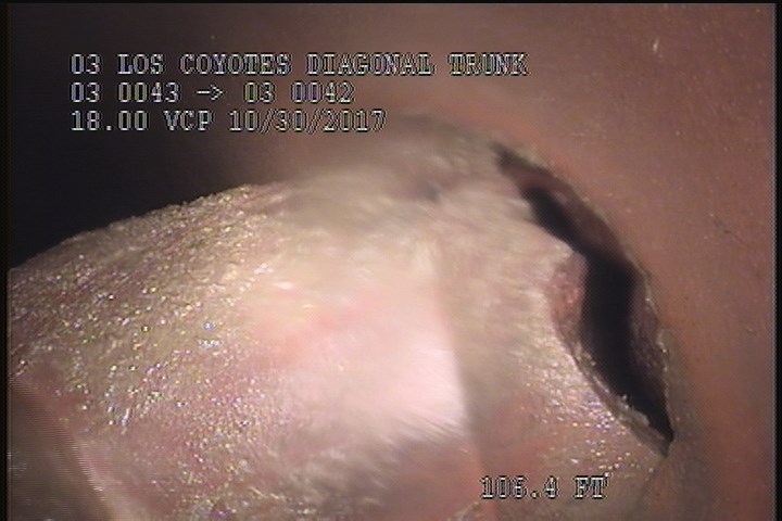 Tap Factory Made Intruding, at 02 o'clock, -, -, within 8 inches of joint: YES, 6", 5" - INTRUDING INTO THE WATER