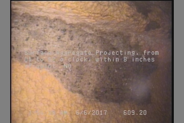 Surface Aggregate Projecting, from 01 to 02 o'clock, within 8 inches of joint: NO