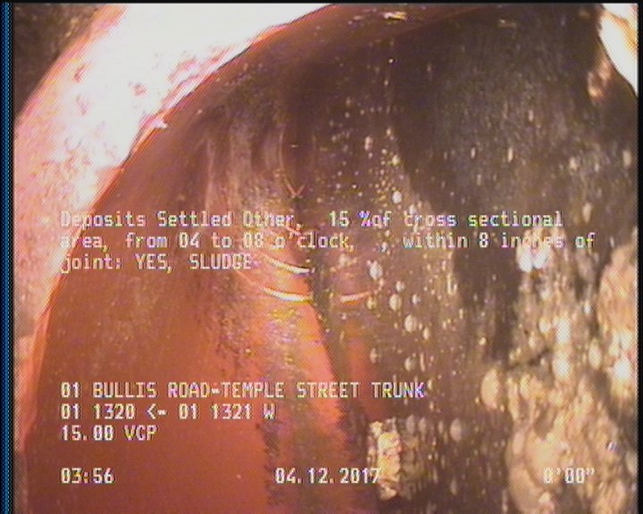 Deposits Settled Other, 15 %of cross sectional area, from 04 to 08 o'clock, , within 8 inches of joint: YES - SLUDGE