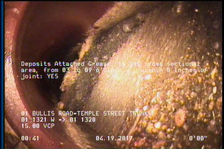 Deposits Attached Grease, 15 %of cross sectional area, from 03 to 09 o'clock, , within 8 inches of joint: YES