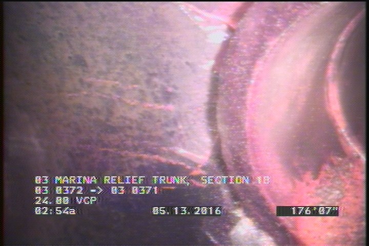Tap Break-In Intruding, at 02 o'clock, -, -, within 8 inches of joint: NO, 6", 2"