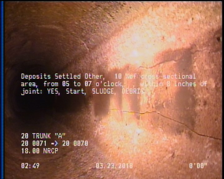 Deposits Settled Other, 10 %of cross sectional area, from 05 to 07 o'clock, , within 8 inches of joint: YES, Start - SLUDGE, DEBRIS