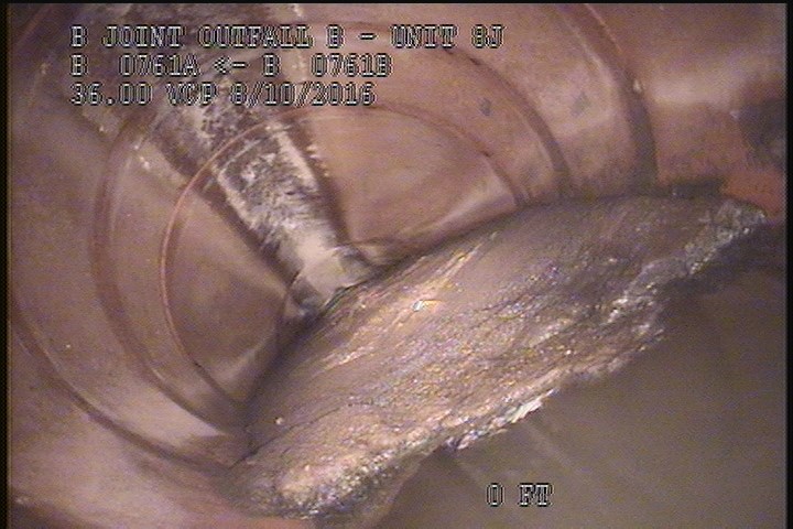 Deposits Settled Other, 20 %of cross sectional area, from 04 to 08 o'clock, , within 8 inches of joint: YES - SLUDGE