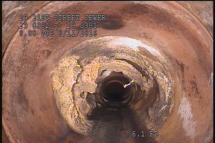 Deposits Attached Encrustation, 20 %of cross sectional area, from 07 to 04 o'clock, , within 8 inches of joint: YES - GREASE/CALCIUM