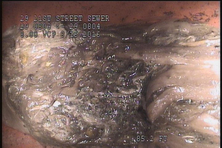 Deposits Attached Grease, 5 %of cross sectional area, from 05 to 07 o'clock, , within 8 inches of joint: YES - AND RAGS