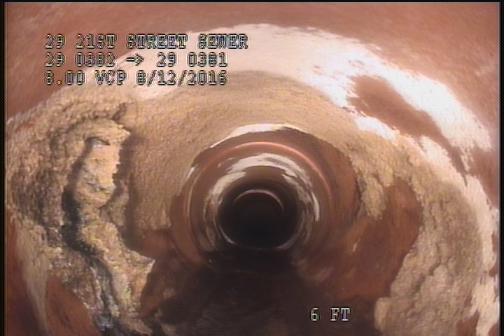 Deposits Attached Encrustation, 5 %of cross sectional area, from 07 to 04 o'clock, , within 8 inches of joint: YES, GREASE/CALCIUM