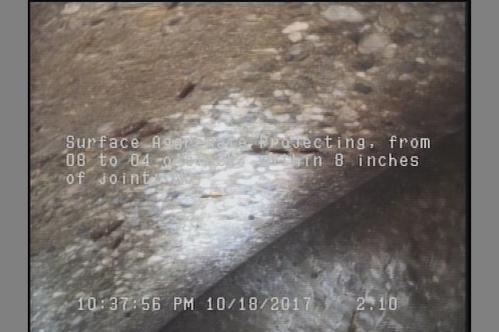 Surface Aggregate Projecting, from 08 to 04 o'clock, within 8 inches of joint: NO