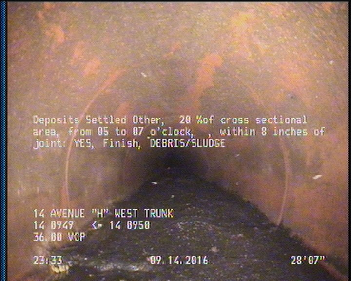 Deposits Settled Other, 20 %of cross sectional area, from 05 to 07 o'clock, , within 8 inches of joint: YES, Finish - DEBRIS/SLUDGE