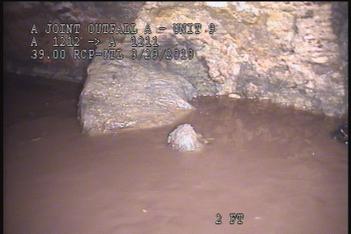 Deposits Settled Other, 15 %of cross sectional area, from 03 to 09 o'clock, , within 8 inches of joint: YES - TILES & UNKNOWN DEBRIS