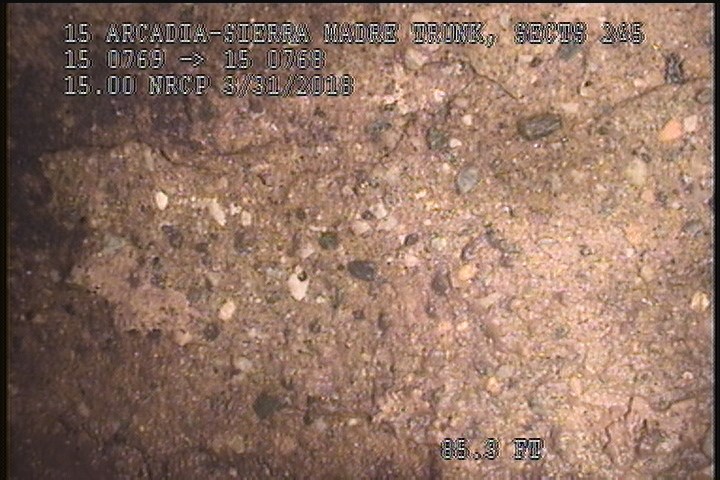 Surface Spalling, from 12 to 03 o'clock, within 8 inches of joint: NO - PEELING CONCRETE MODERATE AGG ATTCHED