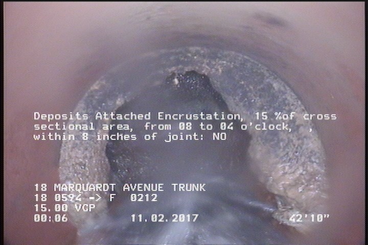 Deposits Attached Encrustation, 15 %of cross sectional area, from 08 to 04 o'clock, , within 8 inches of joint: NO
