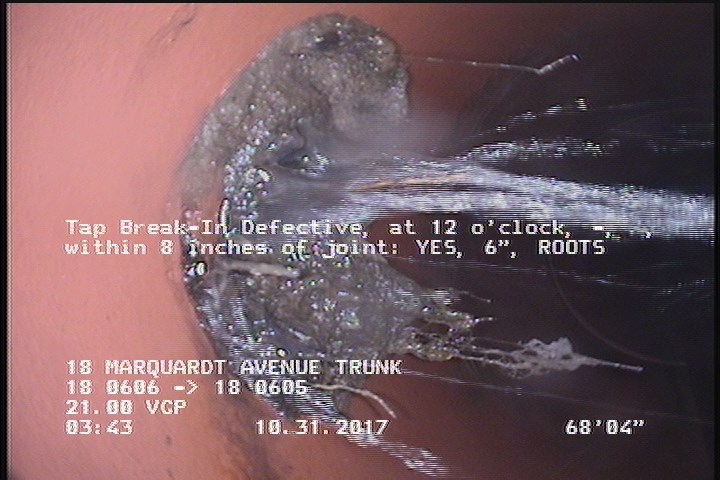 Tap Break-In Defective, at 12 o'clock, -, , within 8 inches of joint: YES, 6" - ROOTS