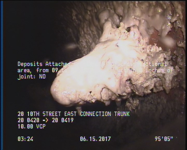 Deposits Attached Grease, 15 %of cross sectional area, from 09 to 03 o'clock, , within 8 inches of joint: NO