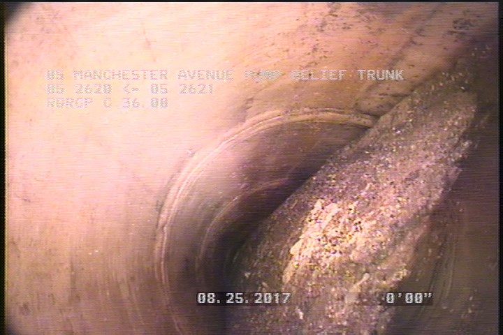Deposits Settled Other, 20 %of cross sectional area, from 03 to 09 o'clock, , within 8 inches of joint: YES - DEBRIS IN THE LINE