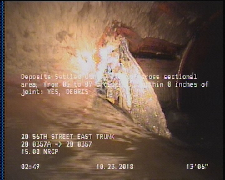 Deposits Settled Other, 15 %of cross sectional area, from 05 to 09 o'clock, , within 8 inches of joint: YES - DEBRIS
