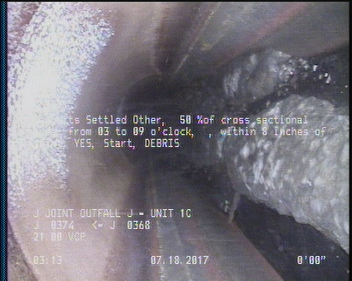 Deposits Settled Other, 50 %of cross sectional area, from 03 to 09 o'clock, , within 8 inches of joint: YES, Start - DEBRIS