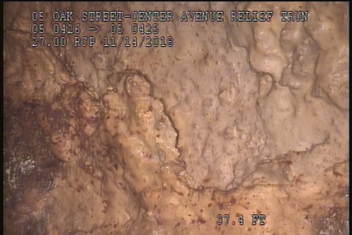 Surface Spalling, from 01 to 03 o'clock, within 8 inches of joint: NO - PEELING CONCRETE UNDER MAG COAT