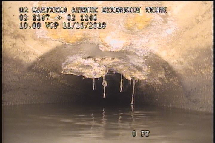 Deposits Attached Grease, 15 %of cross sectional area, from 10 to 02 o'clock, , within 8 inches of joint: NO