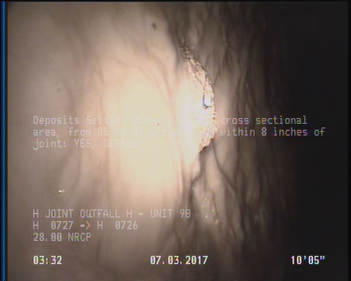 Deposits Settled Other, 15 %of cross sectional area, from 05 to 07 o'clock, , within 8 inches of joint: YES - DEBRIS