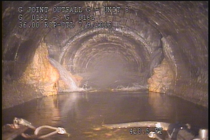Deposits Attached Grease, 20 %of cross sectional area, from 02 to 10 o'clock, , within 8 inches of joint: NO - AT MH OPENIN UPSTREAM