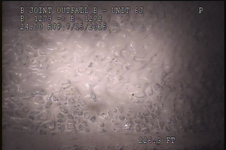 Surface Aggregate Projecting, from 08 to 04 o'clock, within 8 inches of joint: NO - SEVERE AGG UNDER MAG COAT