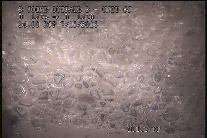 Surface Aggregate Projecting, from 08 to 04 o'clock, within 8 inches of joint: YES - SEVERE AGG UNDER MAG COAT
