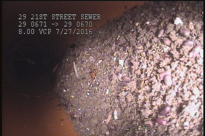 Deposits Attached Other, 10 %of cross sectional area, from 05 to 07 o'clock, , within 8 inches of joint: YES - DEBRIS