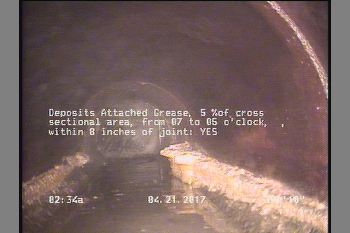 Deposits Attached Grease, 5 %of cross sectional area, from 07 to 05 o'clock, , within 8 inches of joint: YES