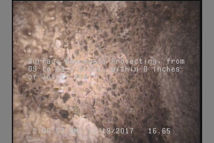 Surface Aggregate Projecting, from 09 to 03 o'clock, within 8 inches of joint: YES