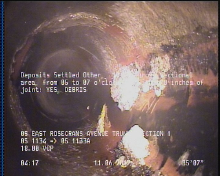 Deposits Settled Other, 10 %of cross sectional area, from 05 to 07 o'clock, , within 8 inches of joint: YES - DEBRIS