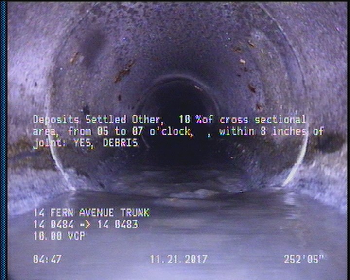 Deposits Settled Other, 10 %of cross sectional area, from 05 to 07 o'clock, , within 8 inches of joint: YES - DEBRIS