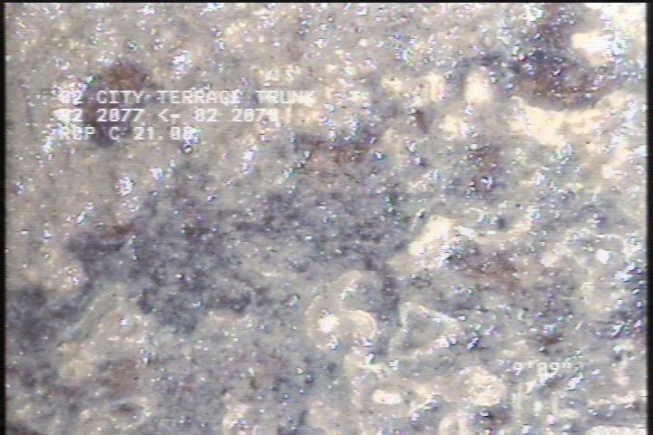 Surface Spalling, from 02 to 03 o'clock, within 8 inches of joint: NO - SLIGHT FLAKING CONCRETE UNDER MAG COAT