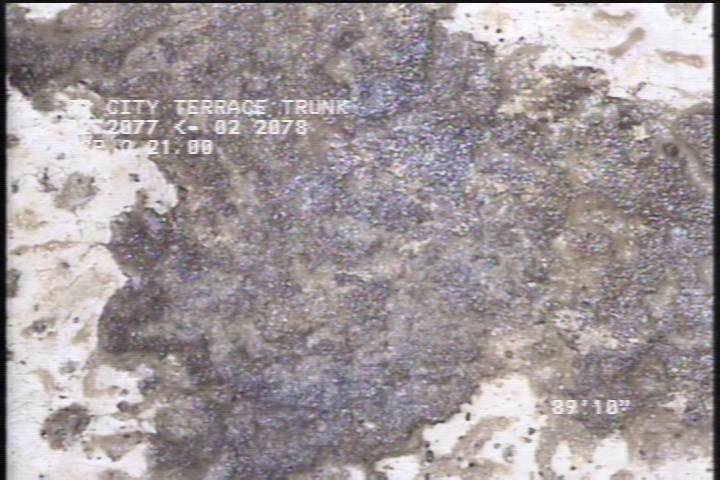 Surface Spalling, from 02 to 03 o'clock, within 8 inches of joint: NO - ROUGH TEXTURED CONCRETE UNDER MAG COAT