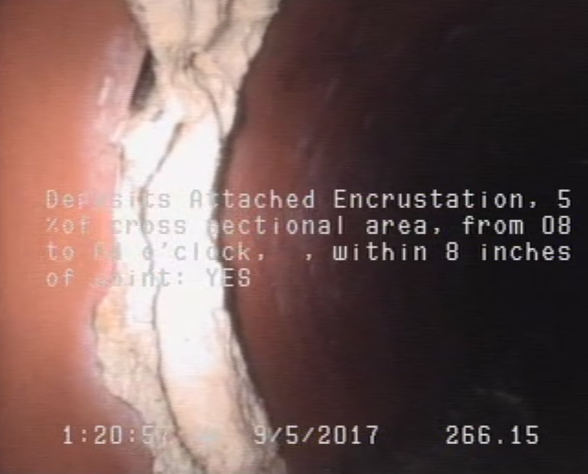 Deposits Attached Encrustation, 5 %of cross sectional area, from 08 to 04 o'clock, , within 8 inches of joint: YES