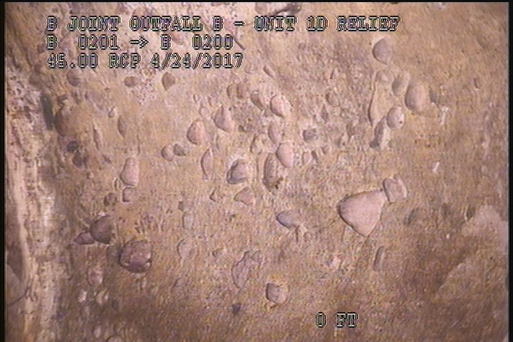 Surface Aggregate Projecting, from 10 to 02 o'clock, within 8 inches of joint: YES - SEVERE AGG