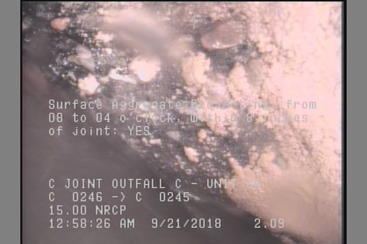 Surface Aggregate Projecting, from 08 to 04 o'clock, within 8 inches of joint: YES