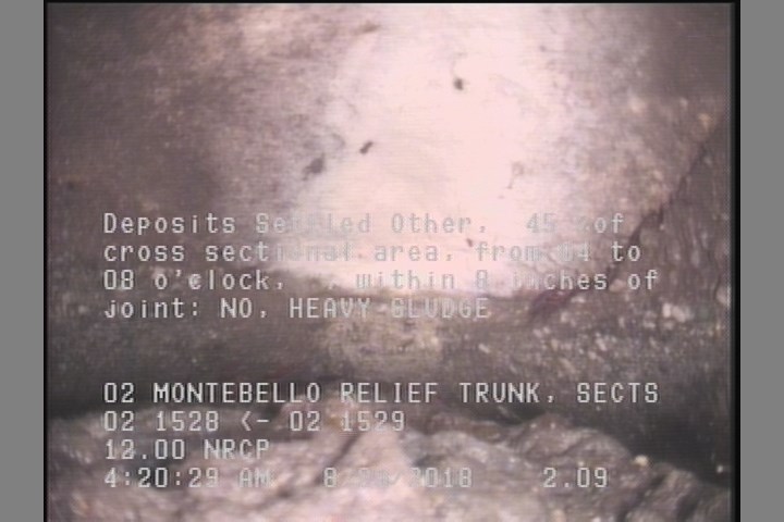Deposits Settled Other, 45 %of cross sectional area, from 04 to 08 o'clock, , within 8 inches of joint: NO - HEAVY SLUDGE