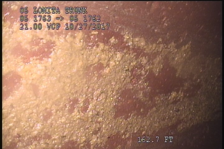 Deposits Settled Gravel, 5 %of cross sectional area, at 12 o'clock, , within 8 inches of joint: YES