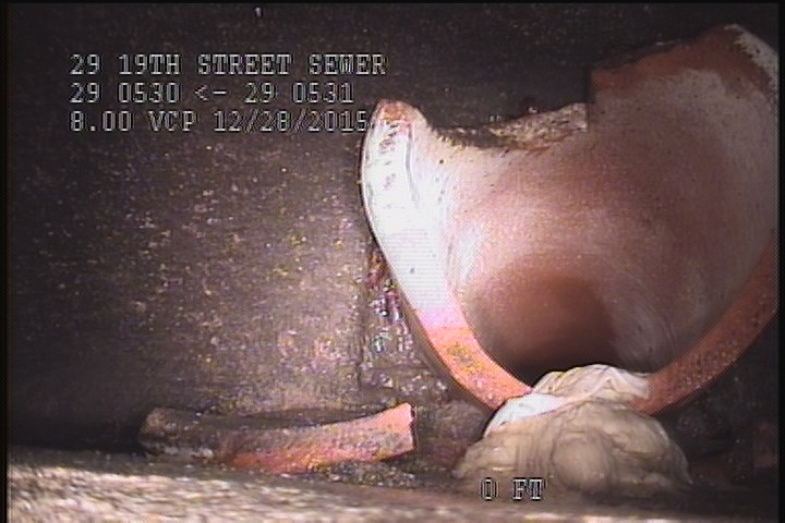 General Observation - BROKEN PIPE SITTING OF THE SHELF INSIDE THE MH.