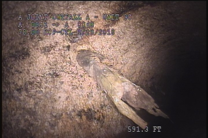 Deposits Attached Other, 5 %of cross sectional area, at 11 o'clock, , within 8 inches of joint: NO - POSSIBLE RAGS CAUGHT ON BROKEN REBAR