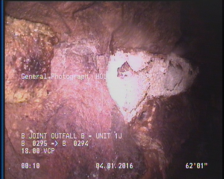 General Photograph - HOLE WITH REPAIR VISIBLE