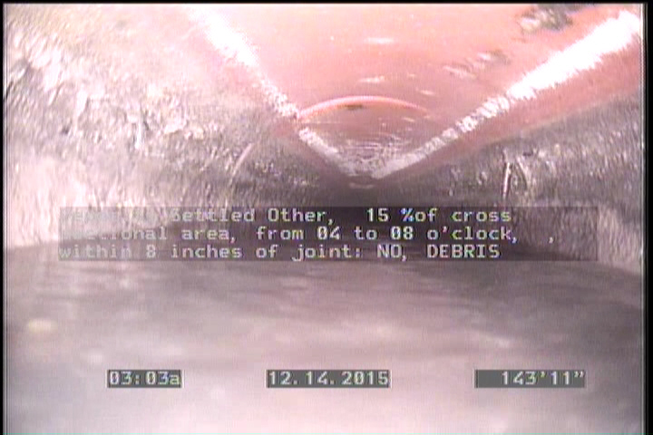 Deposits Settled Other, 15 %of cross sectional area, from 04 to 08 o'clock, , within 8 inches of joint: NO - DEBRIS