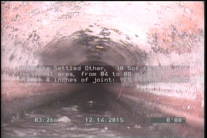 Deposits Settled Other, 30 %of cross sectional area, from 04 to 08 o'clock, , within 8 inches of joint: YES - DEBRIS
