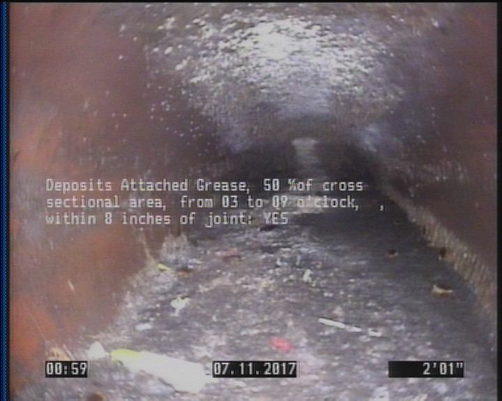 Deposits Attached Grease, 50 %of cross sectional area, from 03 to 09 o'clock, , within 8 inches of joint: YES