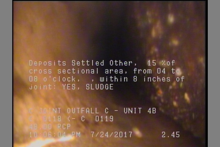 Deposits Settled Other, 15 %of cross sectional area, from 04 to 08 o'clock, , within 8 inches of joint: YES - SLUDGE