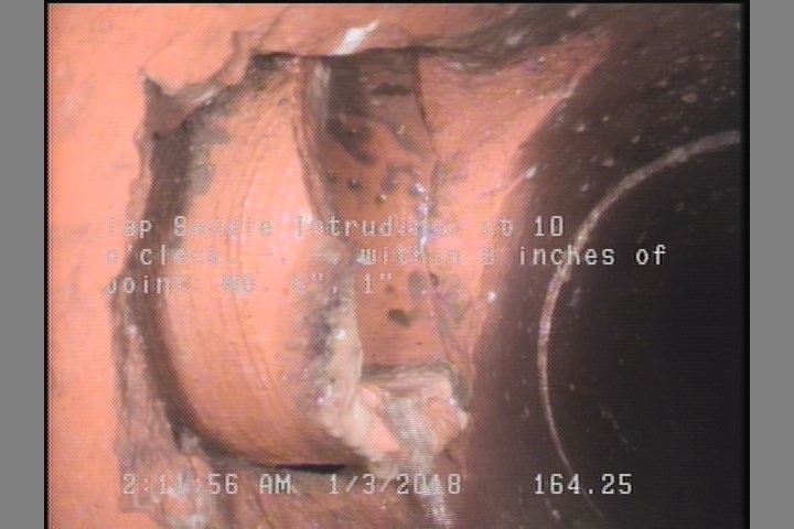 Tap Saddle Intruding, at 10 o'clock, -, -, within 8 inches of joint: NO, 6", 1"