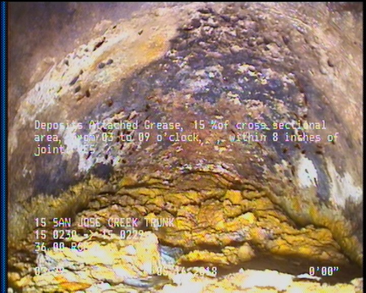 Deposits Attached Grease, 15 %of cross sectional area, from 03 to 09 o'clock, , within 8 inches of joint: YES