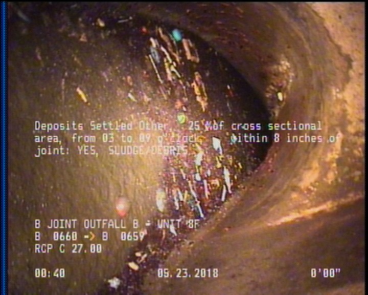 Deposits Settled Other, 25 %of cross sectional area, from 03 to 09 o'clock, , within 8 inches of joint: YES - SLUDGE/DEBRIS
