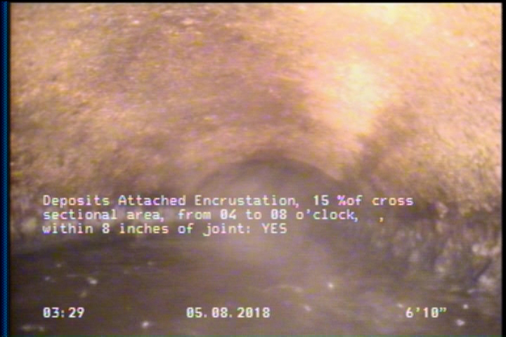 Deposits Attached Encrustation, 15 %of cross sectional area, from 04 to 08 o'clock, , within 8 inches of joint: YES