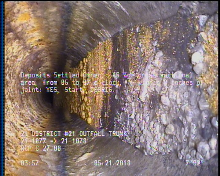 Deposits Settled Other, 15 %of cross sectional area, from 05 to 07 o'clock, , within 8 inches of joint: YES, Start - DEBRIS.